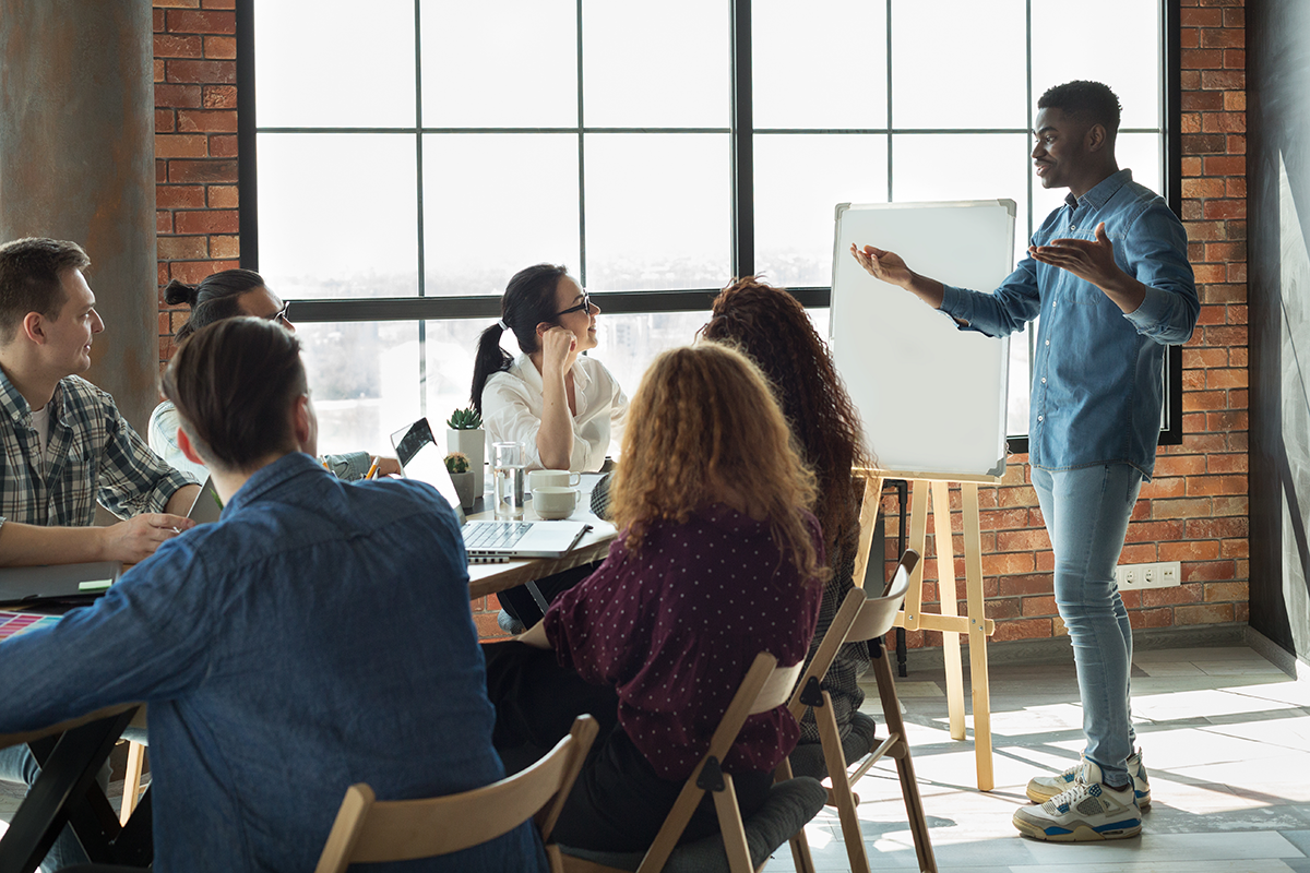 Man presenting to his coworkers